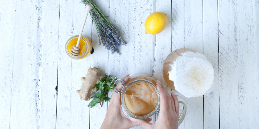A Person Making Kombucha At Home