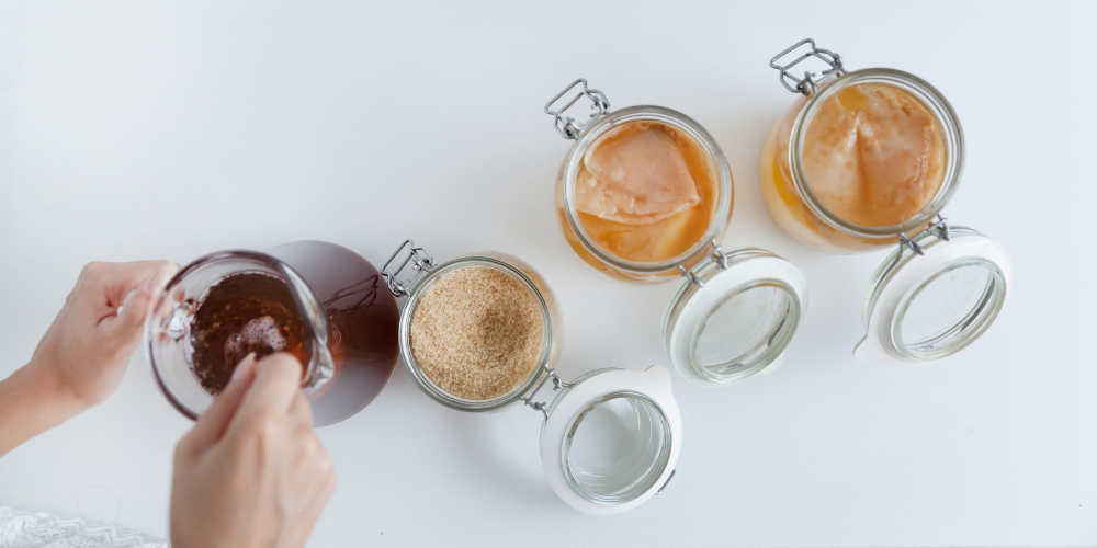 A Person Preparing Kombucha