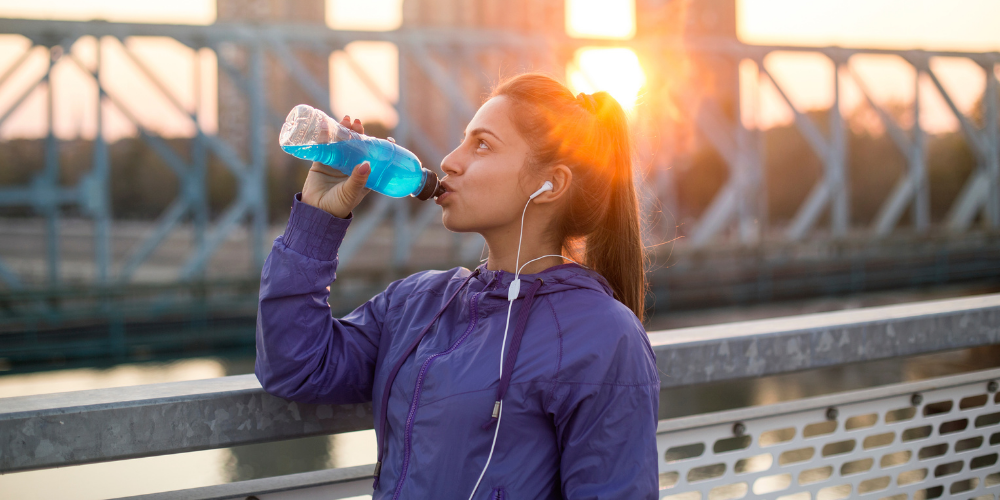 A Photo Of A Woman Drinking Sparkling Ice