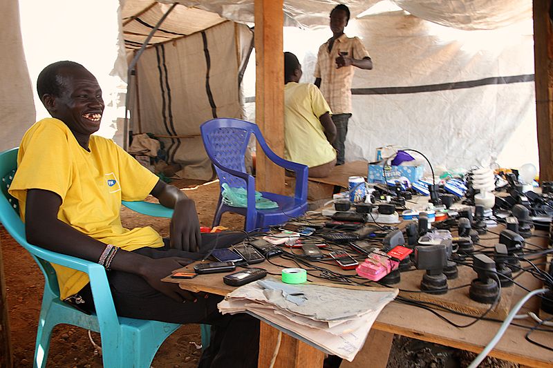 File:Charging mobile phones and light bulbs is a business inside UN House, Juba (12317290513).jpg