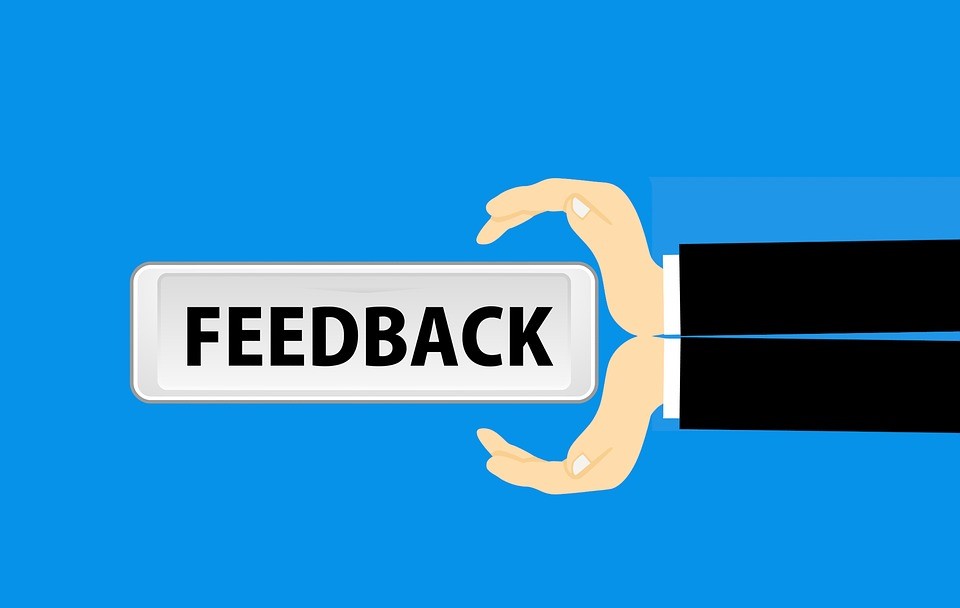 Hands with the words feedback in them