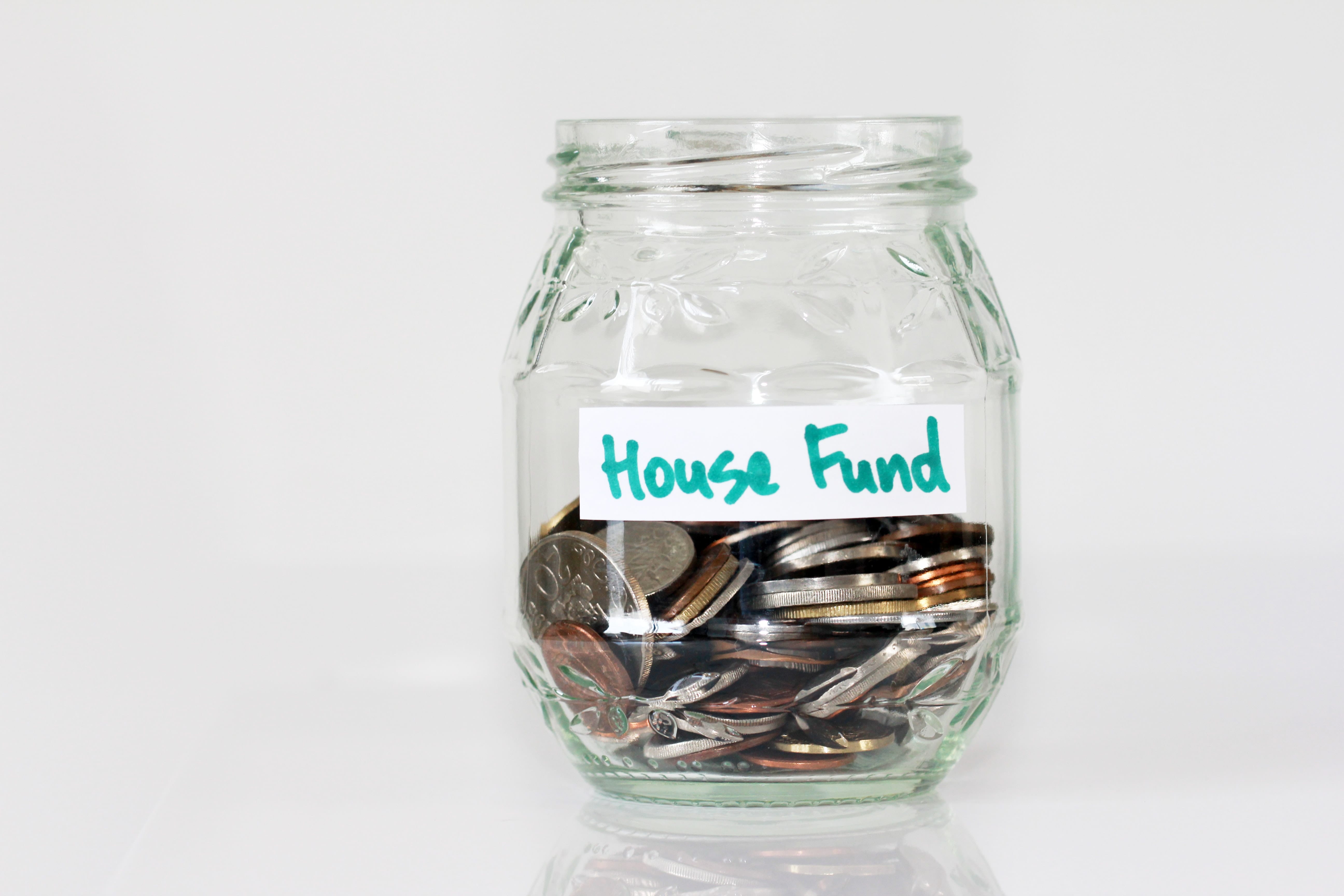 Jar with coins and label "House Funds"
