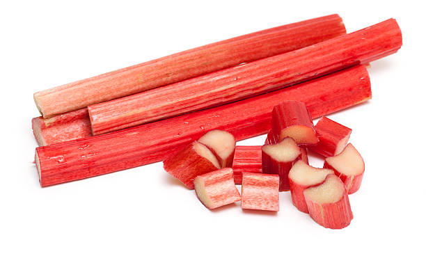 cut rhubarb sticks cut rhubarb sticks isolated on white background rhubarb stock pictures, royalty-free photos & images
