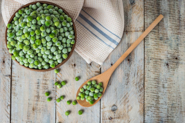 Fresh frozen peas. Fresh frozen peas. Vegetable food background healthy vegetarian natural meal. peas stock pictures, royalty-free photos & images
