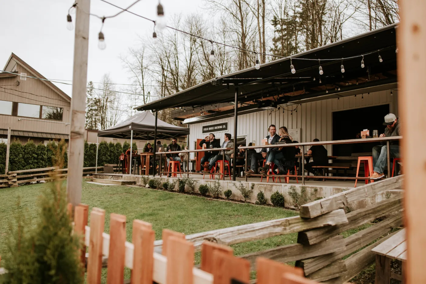 Field House Brewing exterior with fenced in patio for dogs