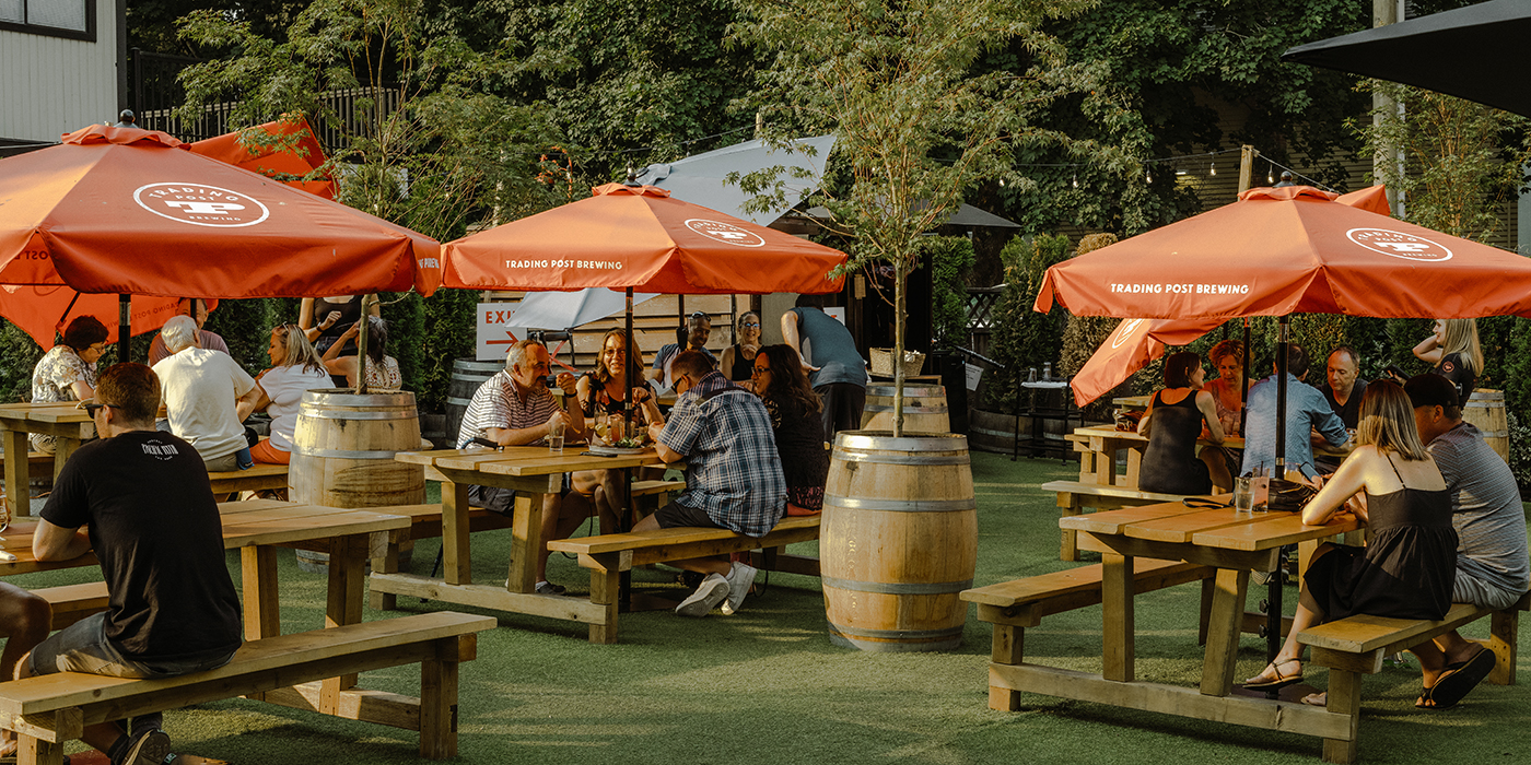 Trading Post patio with picnic bench seating on a sunny afternoon