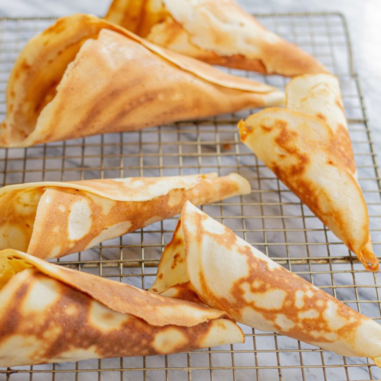 homemade waffle cones on a cooling rack