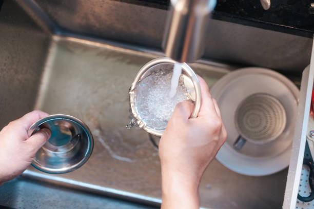 Sanitizing Pet Bowls- Man Hand Washing Pet Bowls - Close Up POV Sanitizing Pet Bowls- Man Hand Washing Pet Bowls - Close Up POV dog dishes cleaning stock pictures, royalty-free photos & images