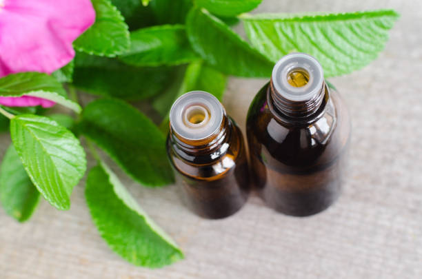Two small bottles of natural cosmetic (essential) aroma oil for skincare and aromatherapy. Two small bottles of natural cosmetic (essential) aroma oil for skincare and aromatherapy. essential oil dog stock pictures, royalty-free photos & images