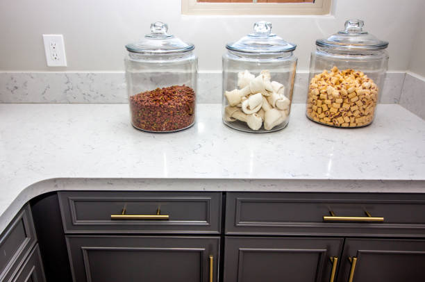 Dog Treat Containers On Kitchen Counter Top Kitchen Counter With Three Glass Containers Of Dog Treats dog food container stock pictures, royalty-free photos & images
