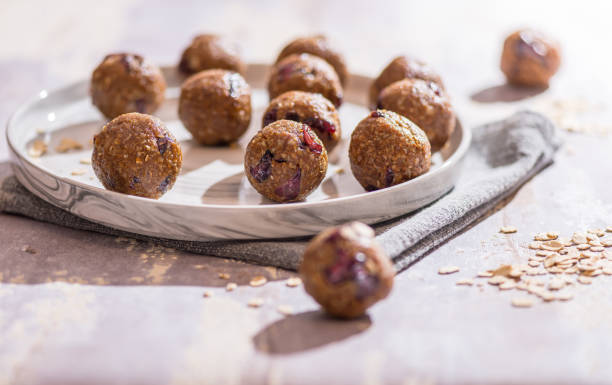 Oatmeal balls , Oats dates energy balls Oatmeal balls , Oats dates and cranberries energy balls, selective focus , close up cranberry balls stock pictures, royalty-free photos & images
