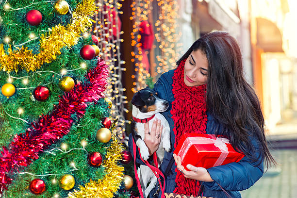 Woman with her dog Happy shopping woman with their dog dog winter market stock pictures, royalty-free photos & images