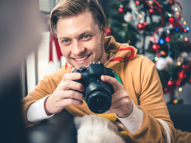 Millennial Christmas party Millennial Christmas party in season costumes. Interior of modern apartment with Christmas decorations. dog christams camera stock pictures, royalty-free photos & images