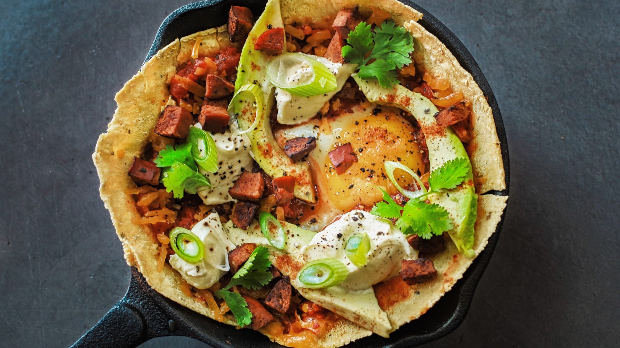 Egg dish with avos in acast iron skillet at ideas cartel