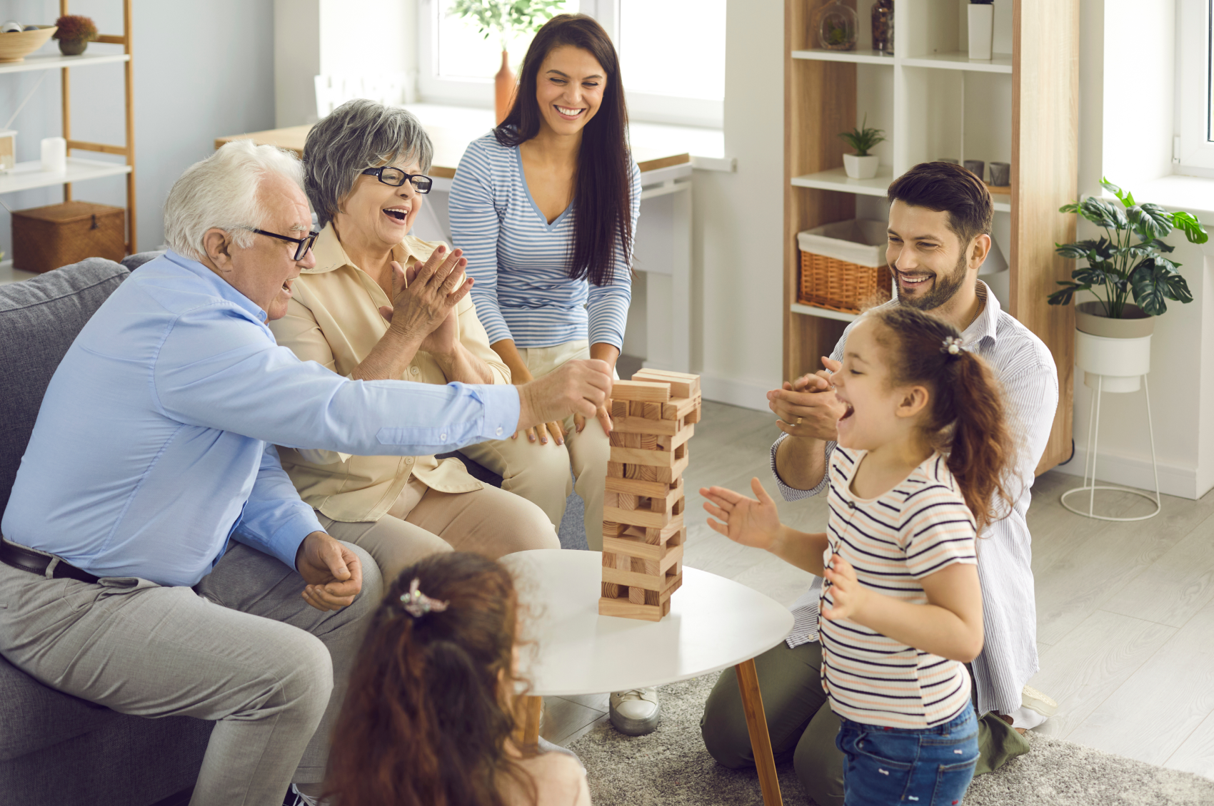 Multiple family generations playing a game