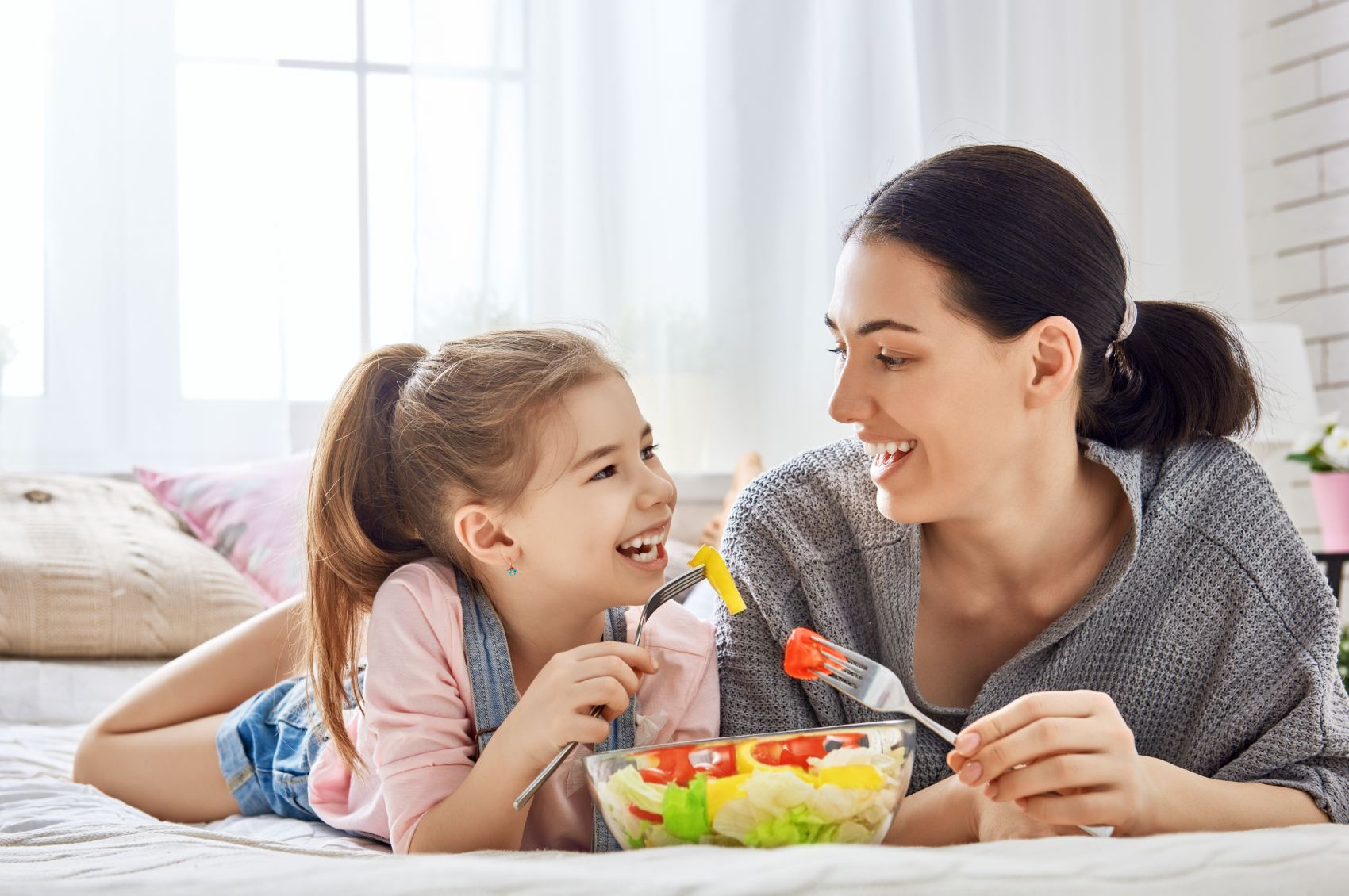 A woman and her daughter eating