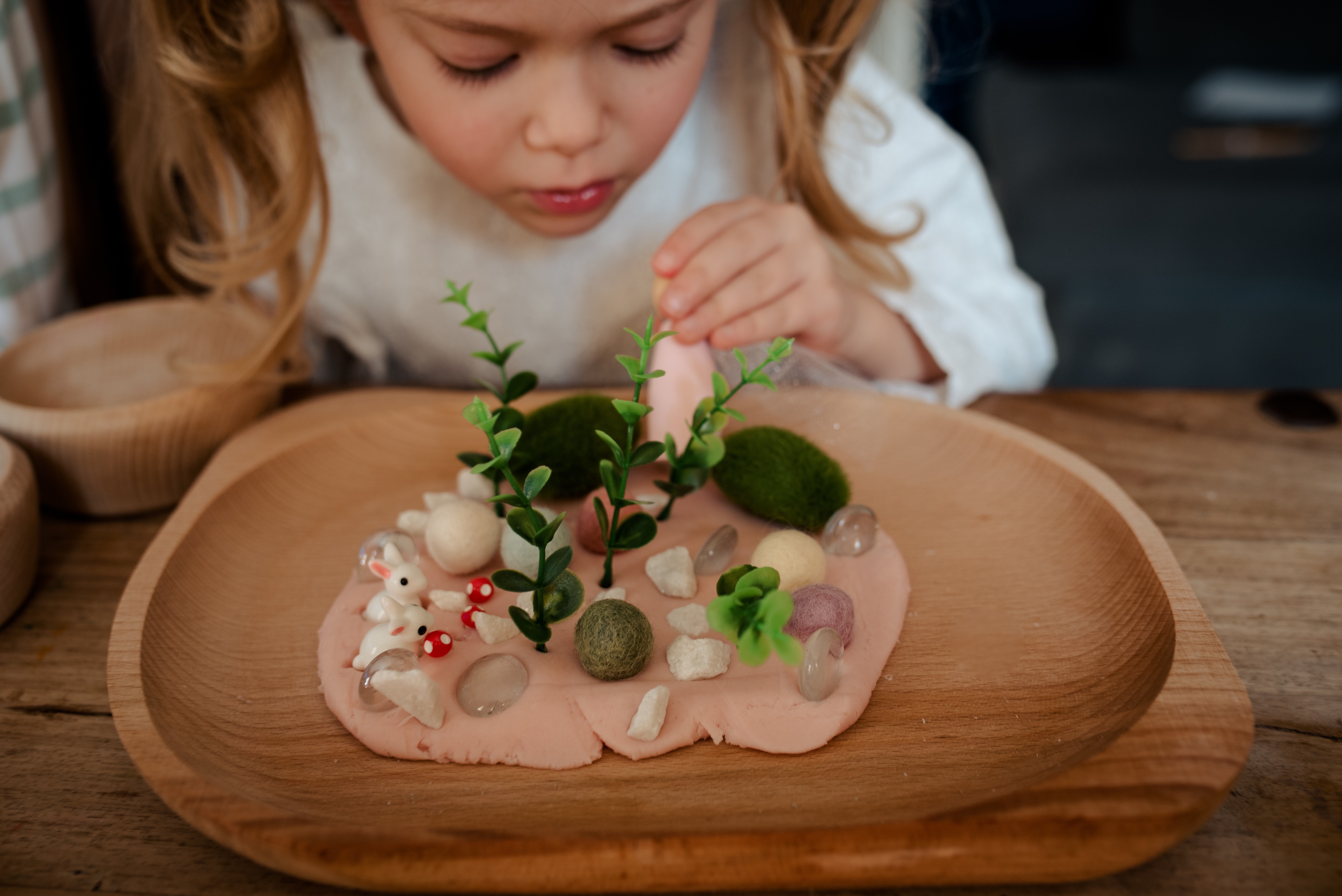 Child playing with dough