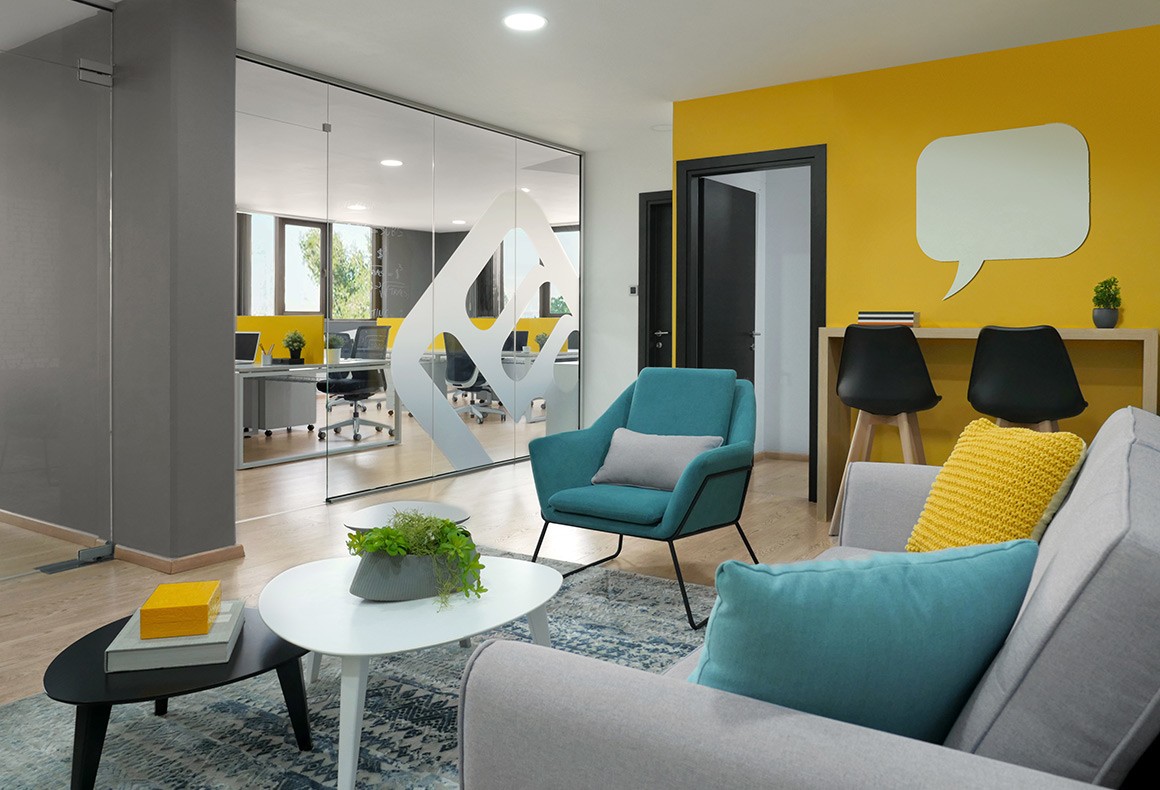 A colorful and hip interior design concept for the lounge of tech company, LearnWorlds.