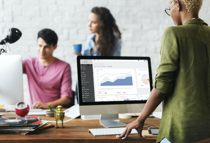 Team working in an office on desktops