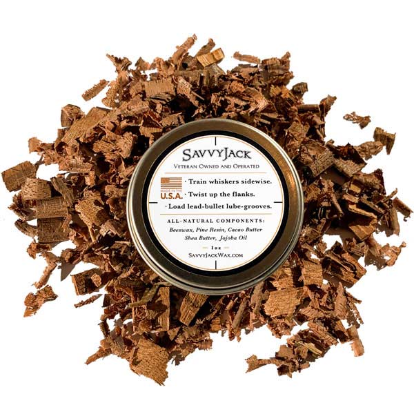 Strong hold SavvyJack mustache wax 1 oz tin. Back of mustache wax tin on wood chips.