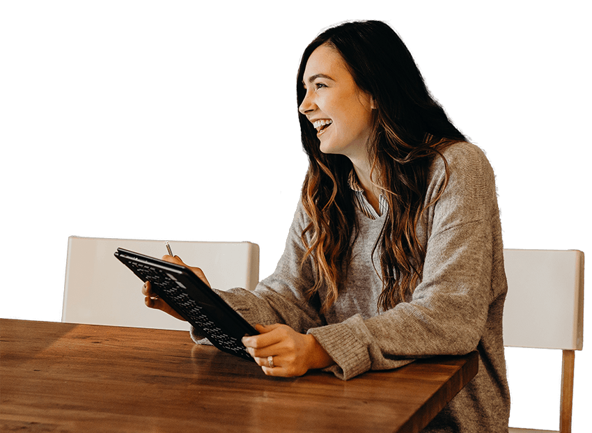 Smiling woman holding an ipad