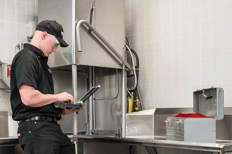 Hobart Tech working on a dishwasher