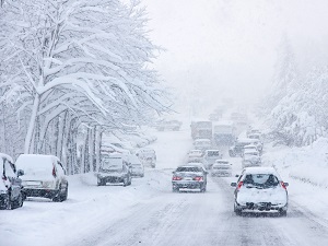 Cars Driving in Snowy Weather