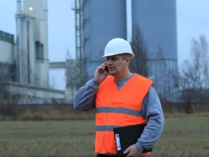 Construction Supervisor Calling in a Hazard Report on Cell Phone