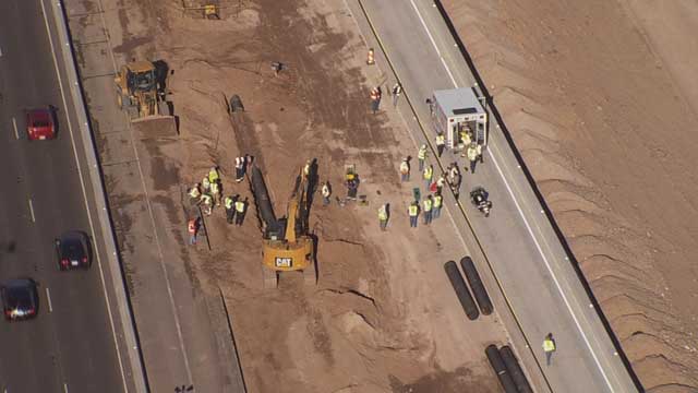 When it was recognized that the men were pinned, the backhoe operator lifted the bucket up.