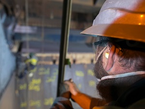 Worker Wearing Ear Plugs