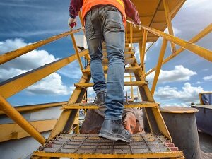 Worker Walking up Fixed Stairs