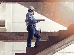 Architect Walking up Stairs, No Guardrail