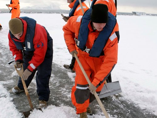 Workers Shoveling Snow