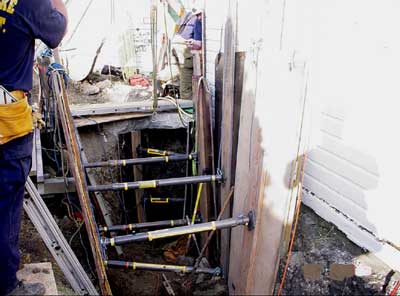 The cave-in protection seen here was only installed after the fatal collapse so that the deceased worker could be safely be removed.