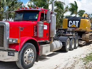 Big Truck Hauling Exavator