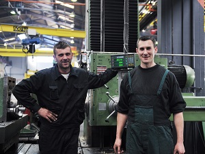 Two Workers in Industrial Workspace
