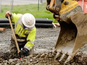 Construction Worker in Excavation Wearing Hard Hat