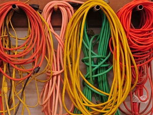 Assorted Extension Cords Hanging Up Neatly