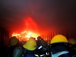 Rescuers in Confined Space with Fire Burning