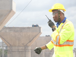 Worker Wearing PPE with Walkie-Talkie