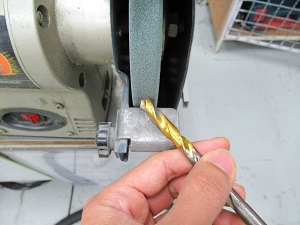 Worker Using a Bench Grinder