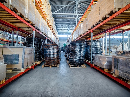 Two Large Spools of Cable Blocking an Aisle of a Warehouse