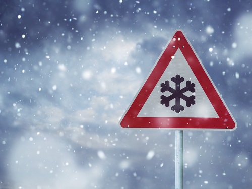 Winter Storm Warning Sign in Snow