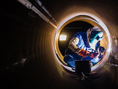 Construction Welder Wearing Face Shield