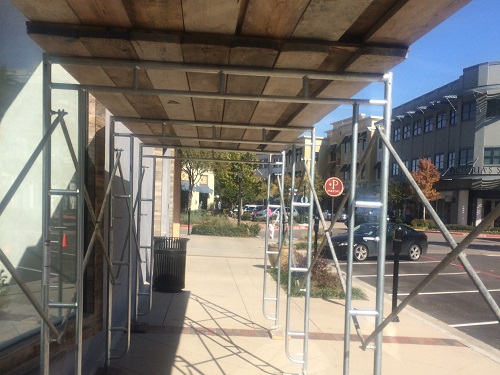 Scaffolding erected for construction at an outdoor mall.