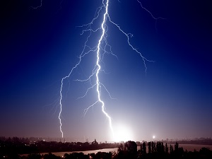 Lightning against a dark blue sky.
