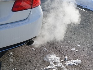 The exhaust coming out of a car.