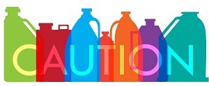 Graphic of colorful cleaning bottles that says the word "Caution".