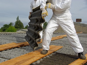 Asbestos workers wearing worksuits, boots, and gloves.