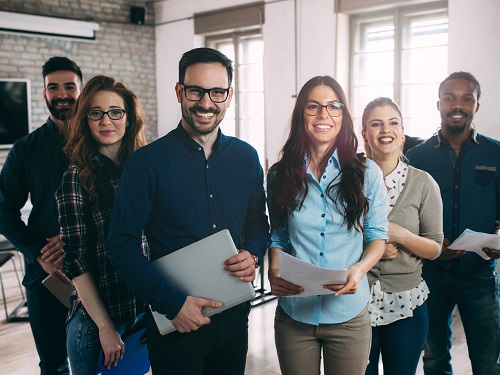 Group of happy workers standing together.